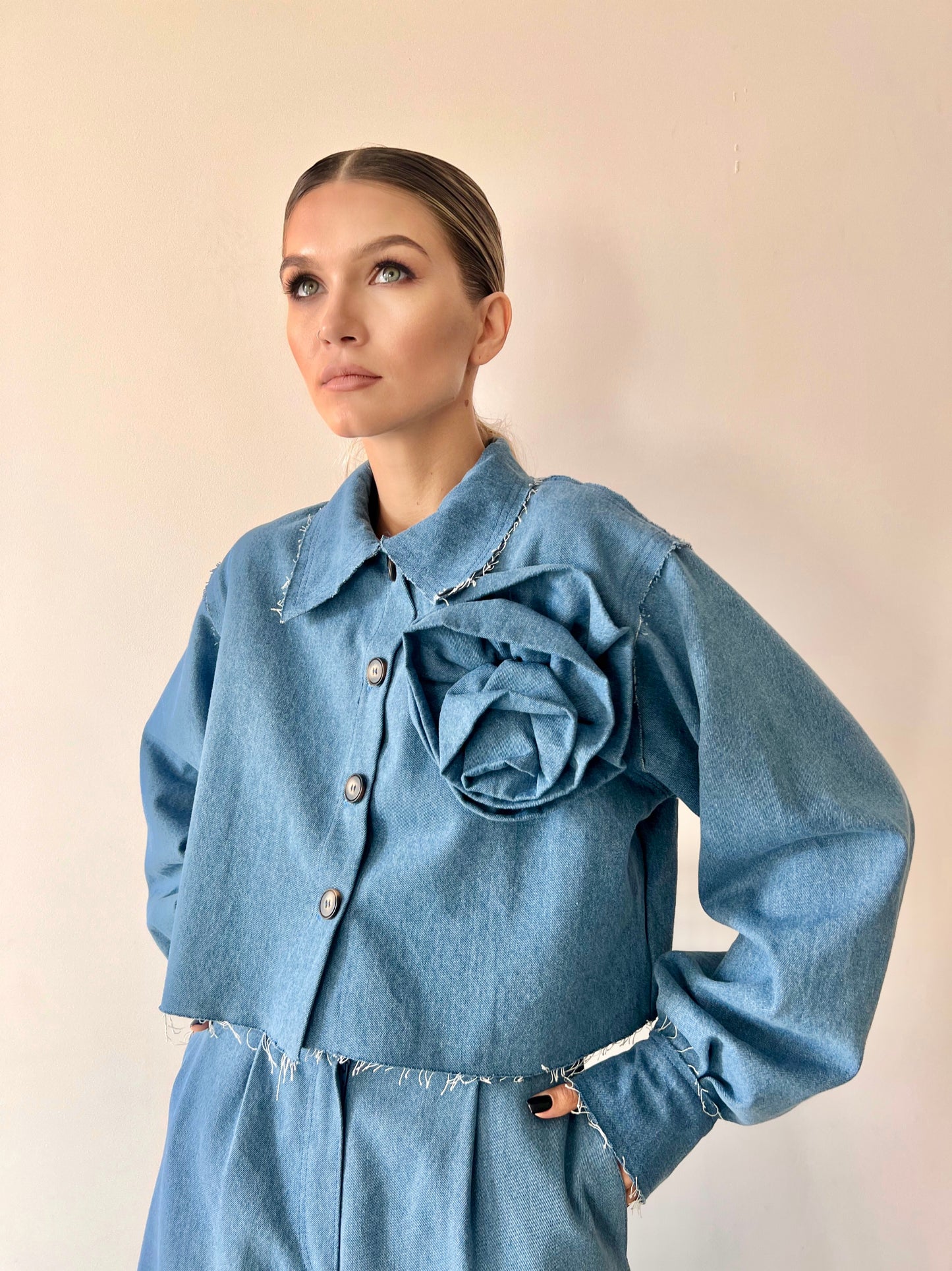 Denim jacket with a flower